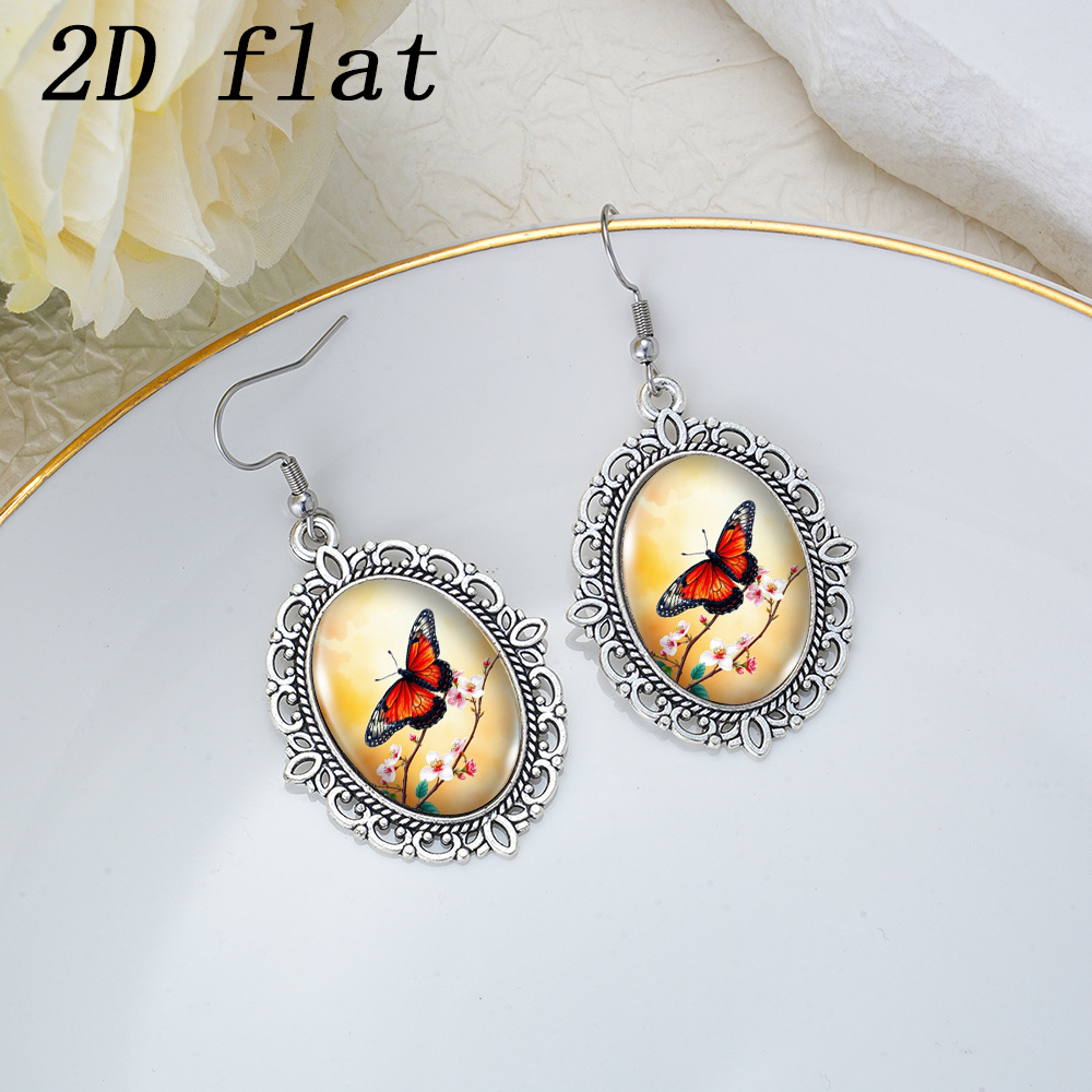 Warm Orange Glow Butterfly Flower Branch Pattern Glass Earrings
